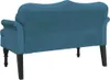 The back view of a blue velvet bench with dark wooden legs against a white background. Podgląd zdjęcia produktu