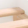 Close-up of wooden bed frame construction. Voir les images du produit