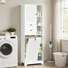 A white storage cabinet with a laundry basket and shelves is shown next to a washing machine in a laundry room. Náhled obrázku produktu