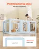 A man interacting with dogs in a transparent pet enclosure. Produktbild-Vorschau