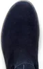 A close-up view of the toe of a dark blue suede boot. Produktbild-Vorschau