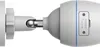 A close-up side view of a white outdoor security camera mounted on a wall bracket. The camera has a reset button and a micro SD card slot visible. Voir les images du produit