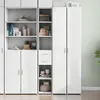 A white highboard with shelves and drawers, filled with various items, set against a light green patterned wallpaper. Voir les images du produit