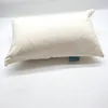 A cream-colored pillow is shown on a white background. Produktbild-Vorschau