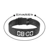 A black digital watch with a textured band is shown against a white background. A measurement line with text indicating '22.4 cm/8.82 in' is overlaid on the image. Produktbild-Vorschau