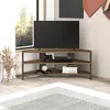 A modern corner TV stand with a television, game console, and books. Podgląd zdjęcia produktu