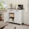 A white buffet cabinet with a tan countertop, holding kitchen items and a coffee maker. Náhľad obrázku produktu