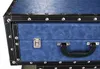 A close-up view of a blue suitcase with black trim and silver hardware. Produktbild-Vorschau