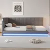 A modern bedroom with a bed, a poster on the wall, and a rug on the floor. Produktbild-Vorschau