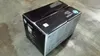 A black HP LaserJet toner cartridge box sits on a textured gray surface. Náhľad obrázku produktu