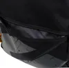Close-up view of an open zipper pocket on a black backpack. Produktbild-Vorschau