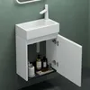 A white bathroom vanity with an open cabinet door, showing toiletries inside. Produktbild-Vorschau