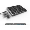 A close-up, studio shot of a wireless numeric keypad with USB ports and connected USB drives. Produktbild-Vorschau