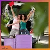 A couple is excited about their trip, posing with luggage next to a car. Náhled obrázku produktu