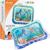 A product box and the inflatable water play mat are shown. The box has graphics and text, while the mat is filled with water and displays a sea creature theme. Podgląd zdjęcia produktu