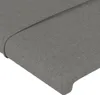 A close-up view of a dark gray fabric headboard. Produktbild-Vorschau