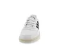 A white Adidas sneaker with black stripes is shown from the front against a white background. Anteprima dell’immagine prodotto