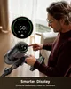 A man is holding a cordless vacuum cleaner and interacting with its digital display. Produktbild-Vorschau