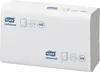 A stack of white TORK Universal paper towels, showing diagrams of dispenser use. Podgląd zdjęcia produktu