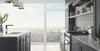 A modern kitchen with a large window overlooking a city skyline. The kitchen features dark cabinets, a marble countertop, and a sleek faucet. Produktbild-Vorschau