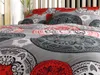 Close-up view of bedding with a mandala-like pattern. Produktbild-Vorschau