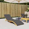 An outdoor patio scene with lounge chairs and a table. Voir les images du produit