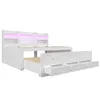 A white storage bed with drawers and a headboard with shelves and LED lighting. Produktbild-Vorschau