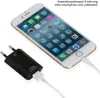 A black USB charger adapter is plugged into a white iPhone, which is displaying its home screen. Produktbild-Vorschau