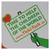 A sign with text and a heart shape, held by a green cartoon hand. Produktbild-Vorschau