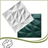 Two 3D wall panels, one white and one dark green, are shown diagonally overlapping against a white background. A green wavy line with a recycling symbol is at the bottom. Podgląd zdjęcia produktu