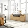 A modern living room with a sideboard featuring an electric fireplace. Produktbild-Vorschau