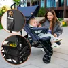 A mother and baby are outdoors with a stroller. The stroller has inset images showing storage compartments. Produktbild-Vorschau