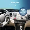 A close-up view of a car's dashboard with a small electronic device mounted on it. Podgląd zdjęcia produktu