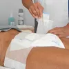 A person is changing an adult diaper on another person. Podgląd zdjęcia produktu