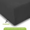 A close-up view of a dark grey fitted sheet, with text overlays indicating product features. Produktbild-Vorschau