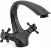 A dark bronze kitchen faucet with two cross-shaped handles. Anteprima dell’immagine prodotto