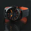 A black Seiko 5 Sports watch with an orange lining on the strap, shown on a reflective black surface. Náhľad obrázku produktu
