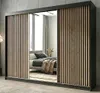 A bedroom scene with a wardrobe in the foreground. Produktbild-Vorschau