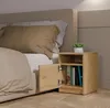 A bedside table next to a bed. Anteprima dell’immagine prodotto