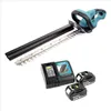 A cordless hedge trimmer with two batteries and a charger, displayed on a white background. Produktbild-Vorschau