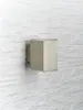 A modern LED outdoor wall light mounted on a textured white brick wall. Produktbild-Vorschau