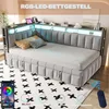 A modern bedroom setup featuring a grey upholstered daybed with integrated LED lighting and a decorative rug. Náhled obrázku produktu