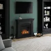 A living room scene featuring an electric fireplace, a television mounted above it, and bookshelves on either side. Produktbild-Vorschau