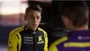Two men in racing suits are looking at each other. Produktbild-Vorschau