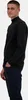 A man wearing a black long-sleeved shirt and dark pants, standing with his hands in his pockets. Náhled obrázku produktu