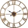 A close-up view of a large, round, metal wall clock with Roman numerals and black hands. Produktbild-Vorschau