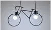 A black bicycle-shaped pendant light with two bulbs. Podgląd zdjęcia produktu