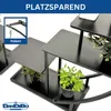 A black tiered plant stand with plants on its shelves, with text overlay indicating it is space-saving. Anteprima dell’immagine prodotto