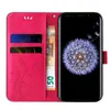 A pink flip phone case with floral and butterfly designs is shown open, revealing card slots and a phone with a dandelion wallpaper. Produktbild-Vorschau
