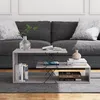 A coffee table with books and a vase in front of a sofa. Voir les images du produit